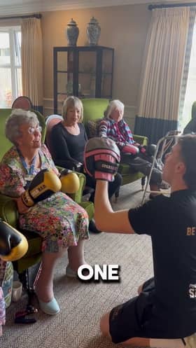 Bailey-Greetham Clark teaches boxing to care home residents.