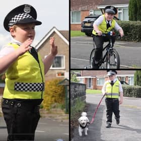 Finley Bollen, six, dresses in an officer's hat and outfit everyday - keeping his town and its people safe on the roads. 
