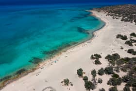 UK holidaymakers could face a £850 fine over a little known rule on Lalaria beach in Skiathos - featured in the film Mamma Mia! (Photo: AFP via Getty Images)