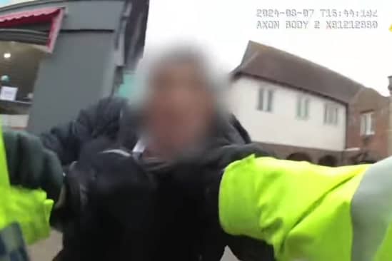 PC Ryan McNamara arrests James Happer.