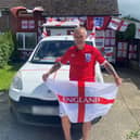 Martin Baker pictured outside his St George's flag covered home. 
