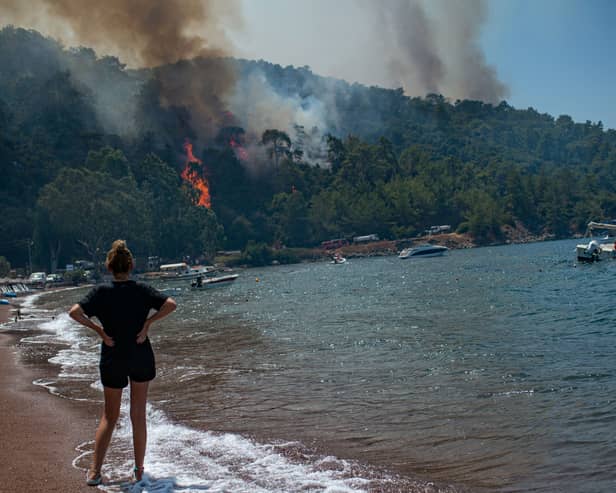 British tourists in Greece have been slapped with an "emergency alert" as a ferocious wildfire rages across the holiday hotspot.