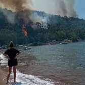 British tourists in Greece have been slapped with an "emergency alert" as a ferocious wildfire rages across the holiday hotspot.