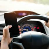 Drivers could be fined if they are caught using a mobile phone while behind the wheel