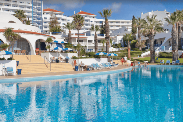 Lounge by the pool at the Grand Muthu Oura View Beach Club