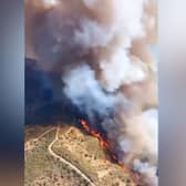 Fire rages between two popular tourist destinations