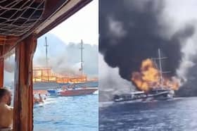 Fire rages through tourist boat as passengers jump into ocean.