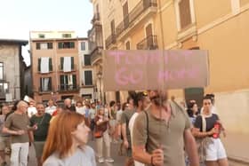Anti-mass tourism protesters march through Palma’s streets.