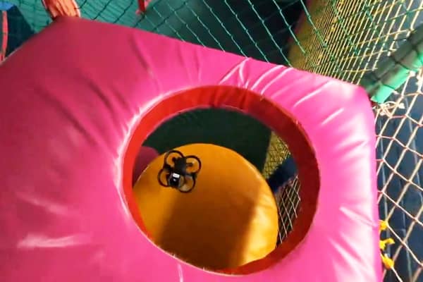 Fascinating footage shows police training drone pilots - in a children's soft play centre. 
