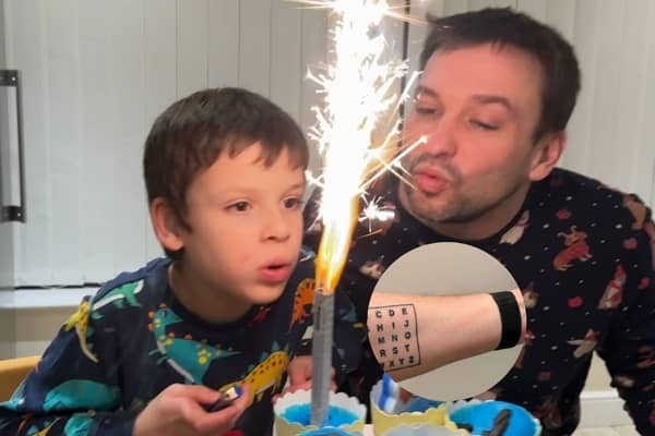 Non-verbal autistic boy communicates using dad's alphabet tattoo