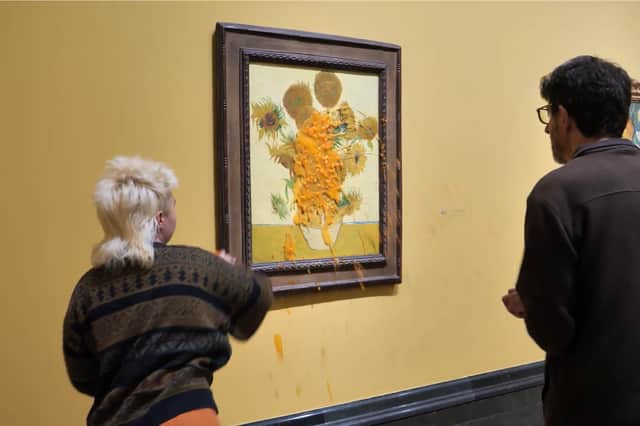 Just Stop Oil throw soup over Van Gogh's Sunflowers for second time.