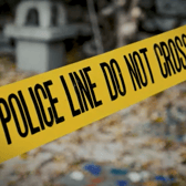 Police tape across crime scene