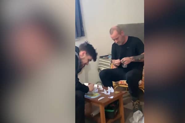 Video grab from footage as Police have mocked a group of dopey dealers who were caught after they videoed themselves bagging up illegal drugs.