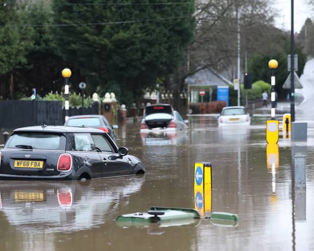 Cars stranded in deep water due to flooding in Stockport.