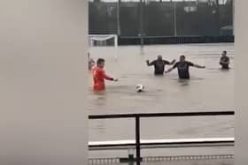 Lydney Town AFC players swim in flooded pitch
