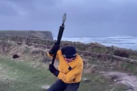 Video taken by the weather tracking group shows their team member battling against the strong winds while attempting to measure the wind speed. 