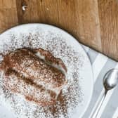 A video of people eating tiramisu straight out of a compartment in their car has went viral. 