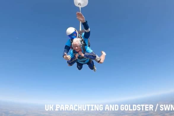 A 102-year-old lady skydiving with an instructor