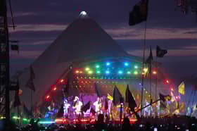 The crowd watching Coldplay performing on the Pyramid Stage at the Glastonbury Festival