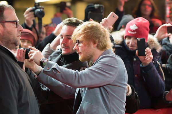 Getting everyone in the shot is Brits biggest frustration when it comes to taking group shots