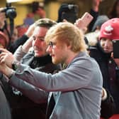 Getting everyone in the shot is Brits biggest frustration when it comes to taking group shots