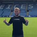 Photo of Matthew getting his photo taken in a Premier League football stadium