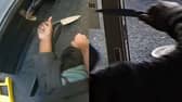 Police officer wrestles and disarms knifeman.
