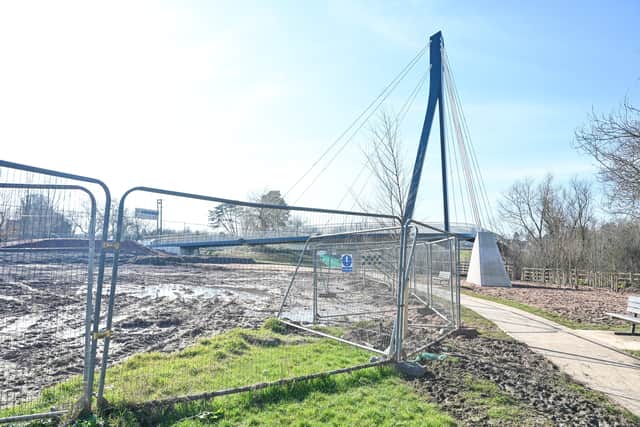 Cyclists wanting to travel on the new £16m Kepax Bridge over the River Severn in Worcester are left with two choices - join a muddy path or turn back and join what cyclists claim is a 'dangerous' road.