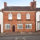 The pretty facade of this charming four-bedroom house in Kenilworth
