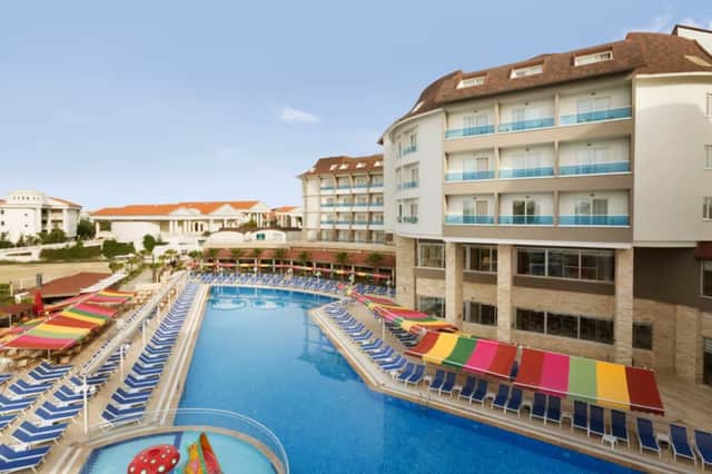 The pool area at a luxury 4-star resort in Antalya, complete with colourful loungers and family-friendly facilities