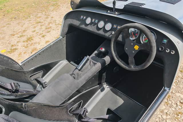 Getting in is tricky, there's nothing in the way of creature comforts and the windscreen is a carbon panel
