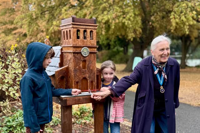 Susan Rasmussen, High Sheriff of Warwickshire formally opens the Christchurch Gardens bug hotel, with help from Jeff and Leo
