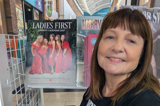 Tracey McAtamney with the calendar at Touchwood Shopping Centre, in Solihull.