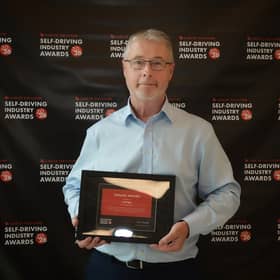 Miles Garner, Chief Commercial Officer at Aurrigo International, accepts the Industrial Design accolade at the Self-Driving Awards.