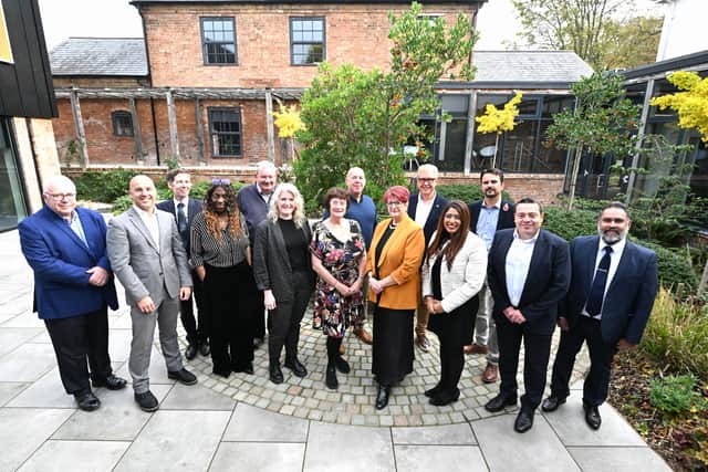 Business and civic leaders gather to watch the Budget