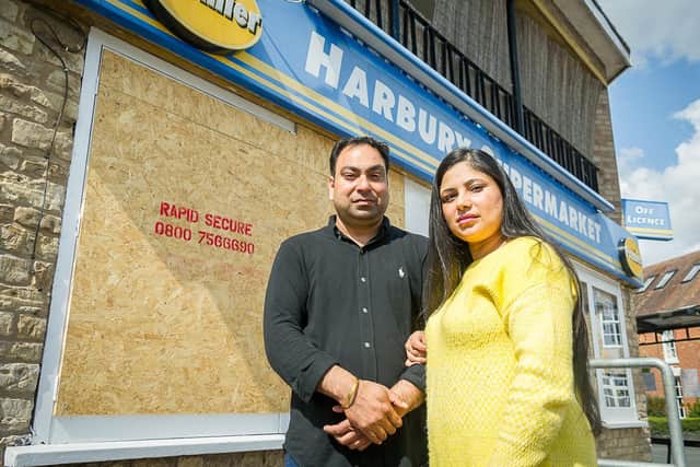 Bob Dhillon & Gurpreet Kaur outside the store after the burglary in August.