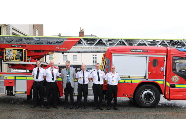 Andy Crump and firefighters with the new appliance.