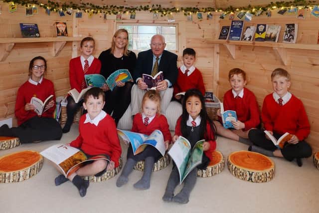 Pupils and staff inside the Book Nook.