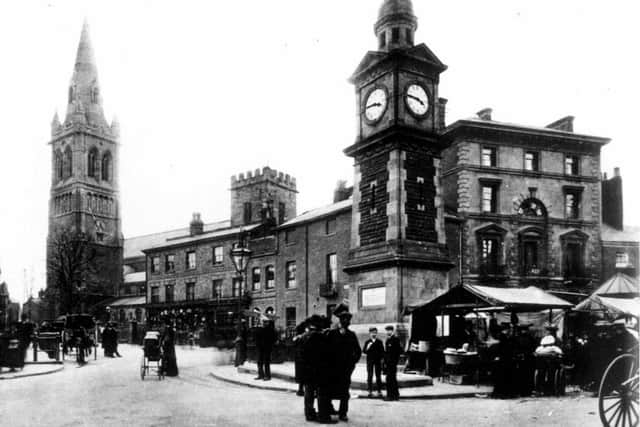 Market Place with The George Hotel on the right and St Andrews Parish Church on the left.