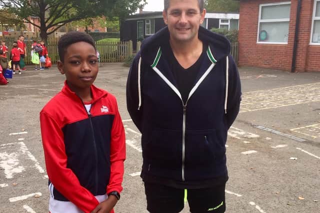 Ethan and Mr Sanderson after having just finished the Cross Country running club after school