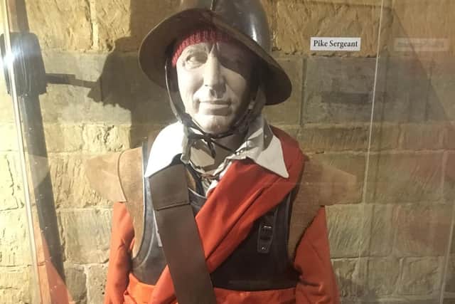 Figure at the exhibition at St Peter's Church in Radway