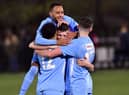 Charlie Evans is mobbed after scoring Rugby Town's second goal with six minutes to go   PICTURES BY MARTIN PULLEY