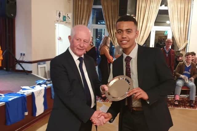 Young Player of the Year Freddie Stephenson receiving the Sean Quigley Plate from his grandfather and founding member  PJ Treacy