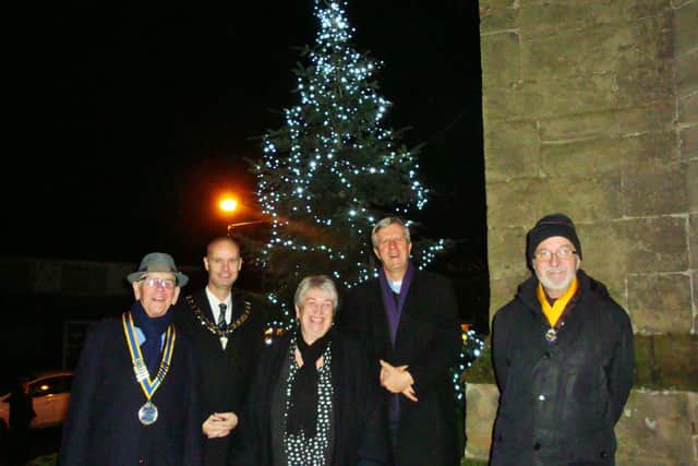 Standing at the Whitnash Tree of Light outside St Margaret's church are president of the Rotary Club of Royal Leamington Spa Colin Robertson,  
Mayor of Whitnash Cllr Robert Margrave, Community Fundraiser of The Myton Hospices Anita Burrows, Vicar of St Margarets Whitnash the Rev Richard Suffern and Vice President of  the Rotary club of Royal Leamington Spa Michael Heath.