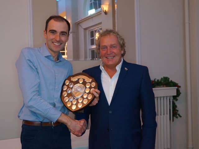Club chairman Martin Orrill (right) presents Oliver Billing with a trophy