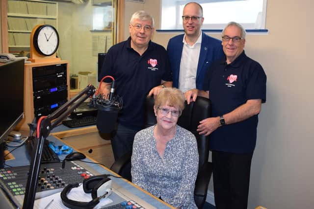 (Back, left to right) Rugby Hospital Radios Mike OConnor, Phil Smith
and current chairman Jim Austin joined Richard Greens wife, Mavis, at the stations
Richard Green Studio.