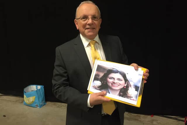 Richard Dickson, the Liberal Democrat candidate, holds a picture of Nazanin Zaghari Ratcliffe