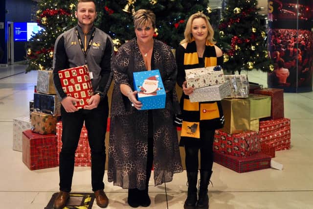 From left, Tom Eales (Wasps), Verity Brown (Wasps) and Aimee Richardson (Wasps) with the shoe boxes