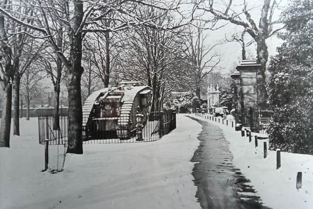A snowy scene of the tank on display in the Rec at Whitehall Road  a few years later, with the memorial gates in their original position in the distance