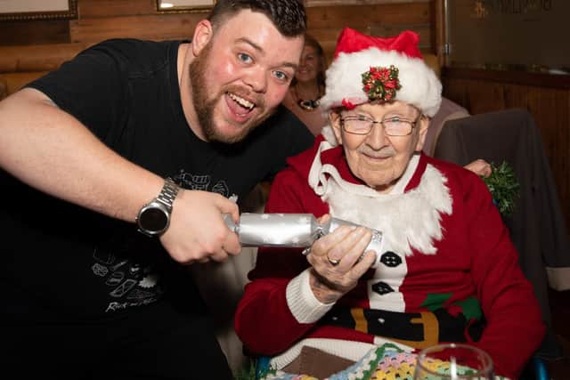 Bill Chapman, Day Care Assistant and youngest choir member with oldest choir member at Galanos House, 102 year old veteran Ron Trenchard